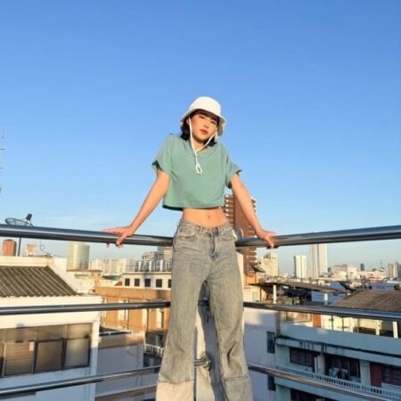 Female model with Oversized Crop Top Pastel Green T-shirt.