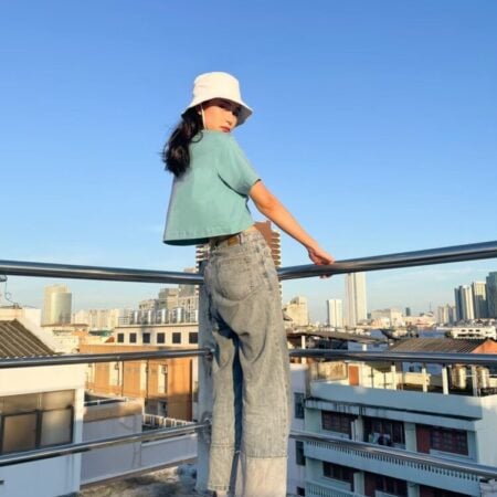 Female model with Oversized Crop Top Pastel Green T-shirt.