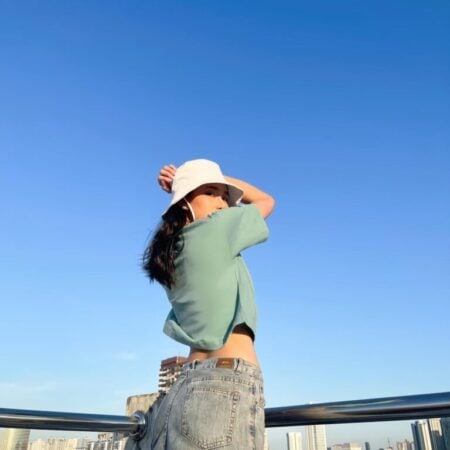 Female model with Oversized Crop Top Pastel Green T-shirt.