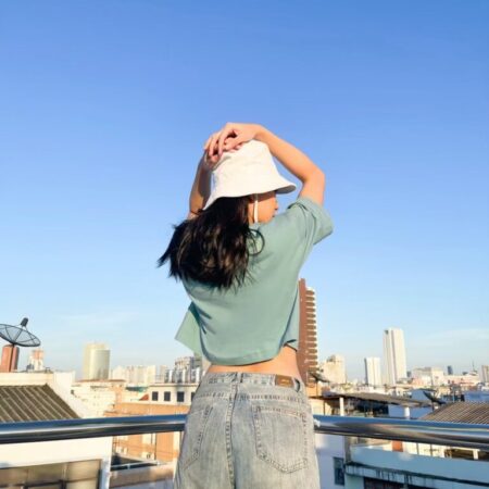 Female model with Oversized Crop Top Pastel Green T-shirt.