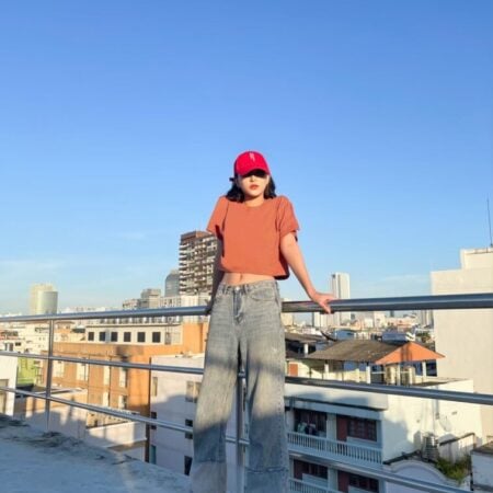 Female model with Oversized Crop Top Brick Orange T-shirt.