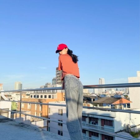 Female model with Oversized Crop Top Brick Orange T-shirt.