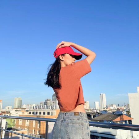 Female model with Oversized Crop Top Brick Orange T-shirt.
