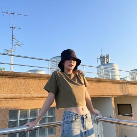 Female model with Oversized Crop Top Olive T-shirt.