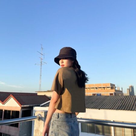 Female model with Oversized Crop Top Olive T-shirt.