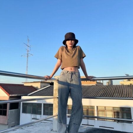 Female model with Oversized Crop Top Olive T-shirt.