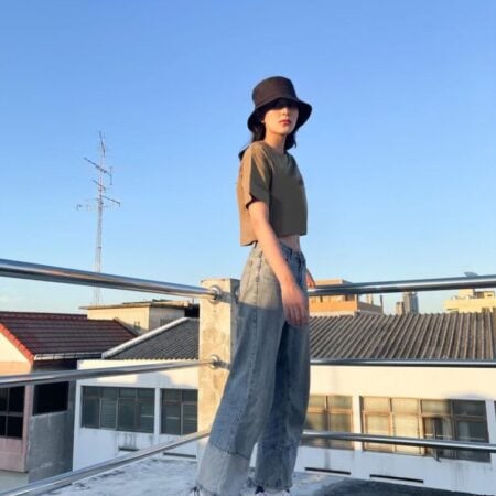 Female model with Oversized Crop Top Olive T-shirt.