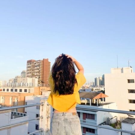 Female model with Oversized Crop Top Mustard T-shirt.