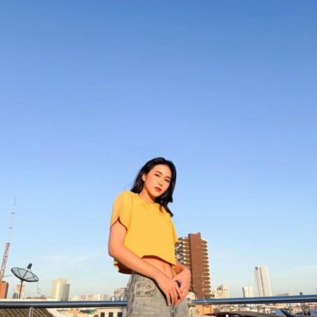 Female model with Oversized Crop Top Mustard T-shirt.