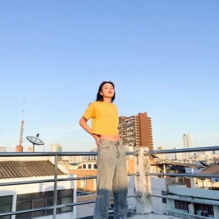 Female model with Oversized Crop Top Mustard T-shirt.
