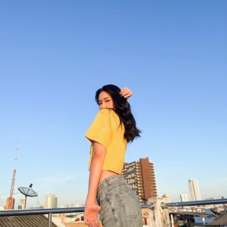 Female model with Oversized Crop Top Mustard T-shirt.