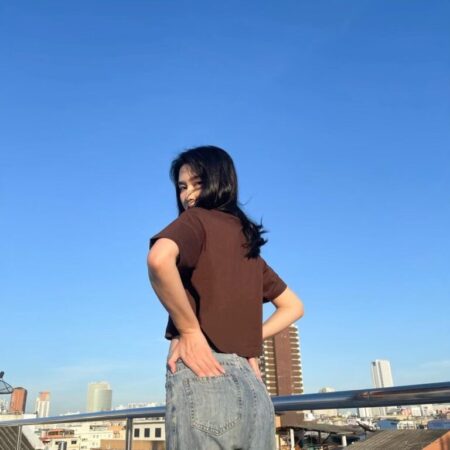 Female model with Oversized Crop Top Dark Chocolate T-shirt.