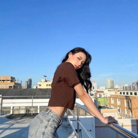 Female model with Oversized Crop Top Dark Chocolate T-shirt.
