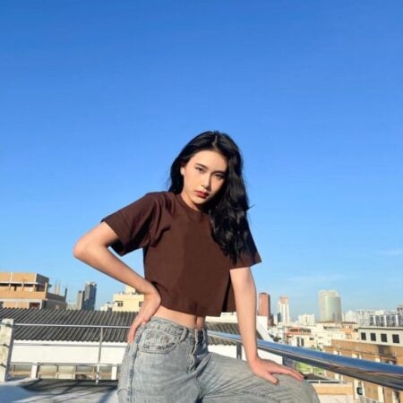 Female model with Oversized Crop Top Dark Chocolate T-shirt.