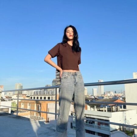 Female model with Oversized Crop Top Dark Chocolate T-shirt.