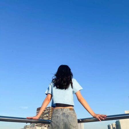 Female model with Oversized Crop Top Blue T-shirt.