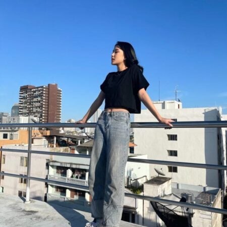 Female model with Oversized Crop Top Black T-shirt.