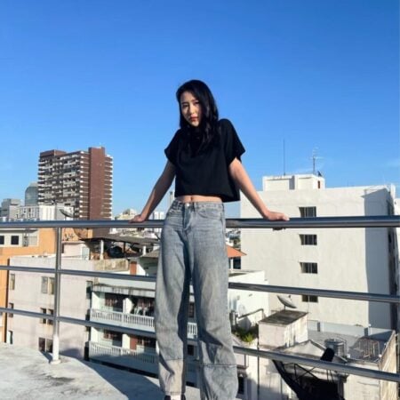 Female model with Oversized Crop Top Black T-shirt.