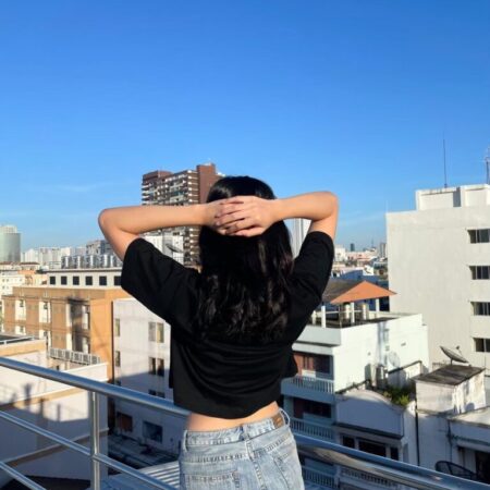 Female model with Oversized Crop Top Black T-shirt.