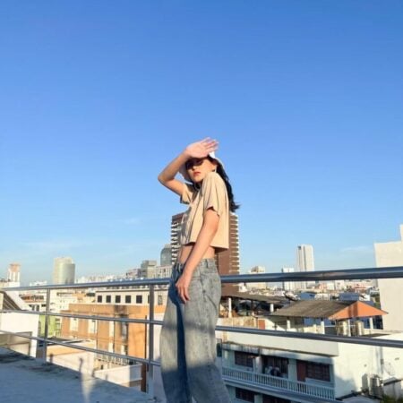 Female model with Oversized Crop Top Beige T-shirt.