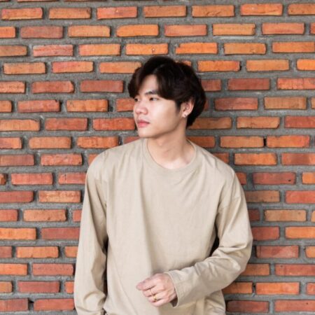 Male model with Oversized Long Sleeves Beige T-shirt.