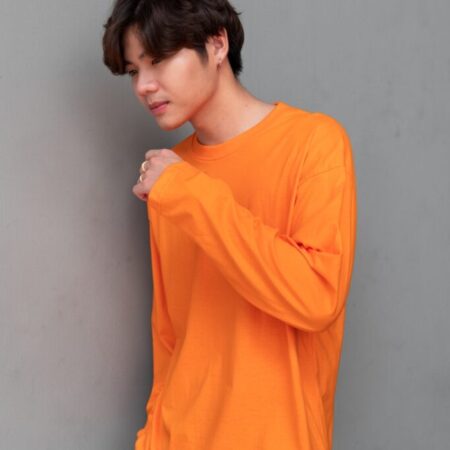 Male model with Oversized Long Sleeves Pumpkin Orange T-shirt.