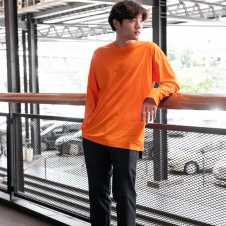 Male model with Oversized Long Sleeves Pumpkin Orange T-shirt.
