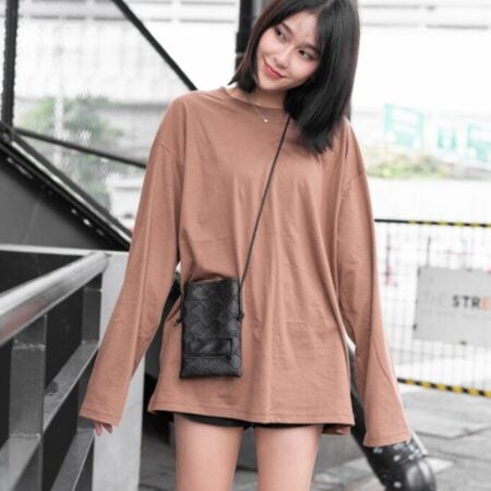 Female model with oversized long sleeves Light Chocolate T-shirt.