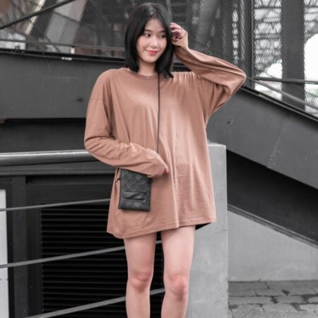 Female model with oversized long sleeves Light Chocolate T-shirt.