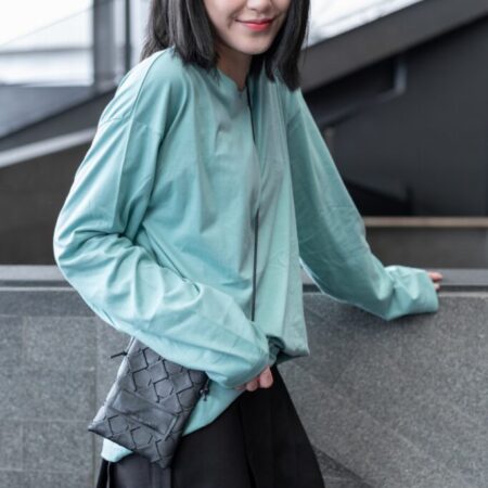 Female model with oversized long sleeves Pastel Green T-shirt.