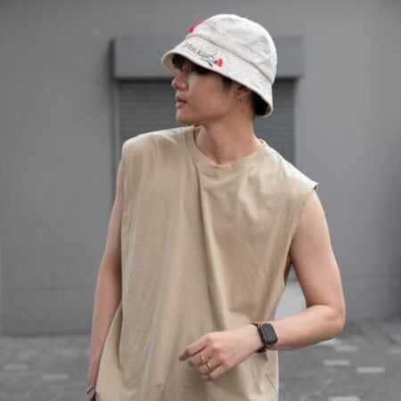 Male model with Oversized Tank Top Beige T-shirt.