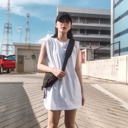 Female model with Oversized Tank Top White T-shirt.