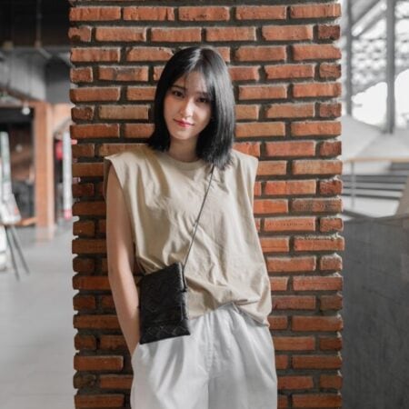 Female model with Oversized Tank Top Beige T-shirt.