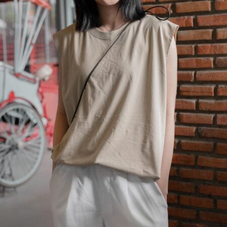 Female model with Oversized Tank Top Beige T-shirt.