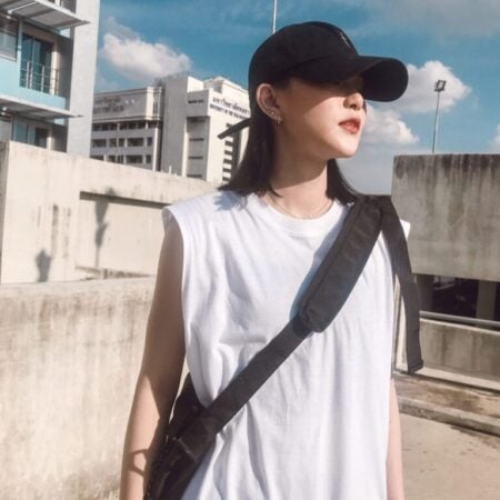 Female model with Oversized Tank Top White T-shirt.