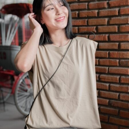 Female model with Oversized Tank Top Beige T-shirt.