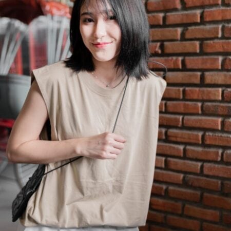 Female model with Oversized Tank Top Beige T-shirt.