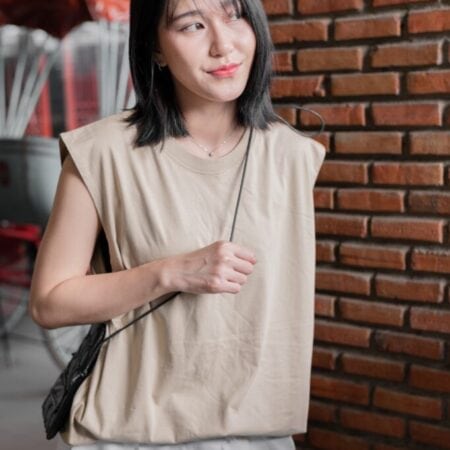 Female model with Oversized Tank Top Beige T-shirt.