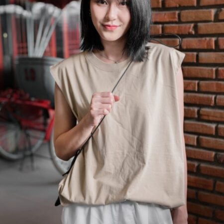 Female model with Oversized Tank Top Beige T-shirt.