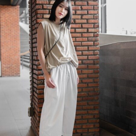 Female model with Oversized Tank Top Beige T-shirt.