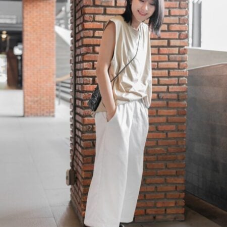 Female model with Oversized Tank Top Beige T-shirt.