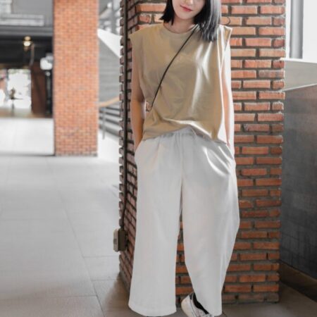 Female model with Oversized Tank Top Beige T-shirt.