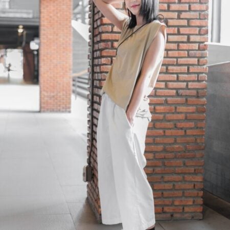 Female model with Oversized Tank Top Beige T-shirt.