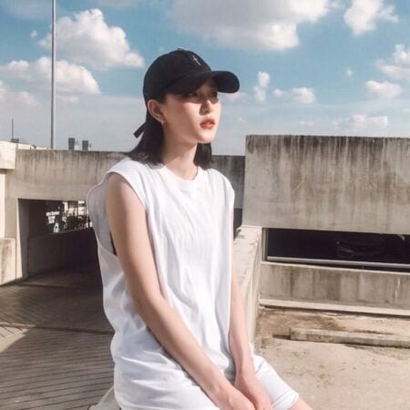 Female model with Oversized Tank Top White T-shirt.