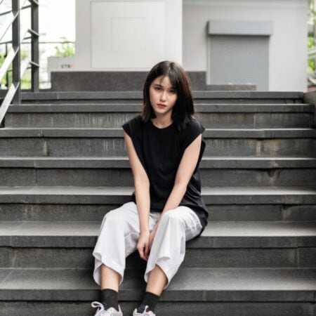 Female model with Oversized Tank Top Black T-shirt.