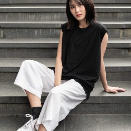 Female model with Oversized Tank Top Black T-shirt.