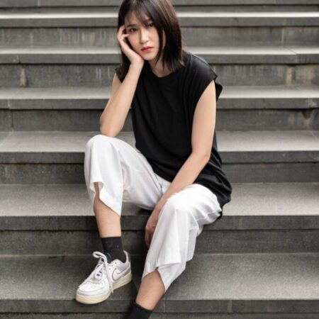 Female model with Oversized Tank Top Black T-shirt.