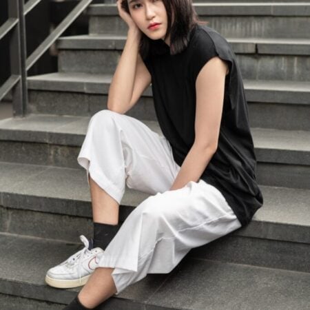 Female model with Oversized Tank Top Black T-shirt.
