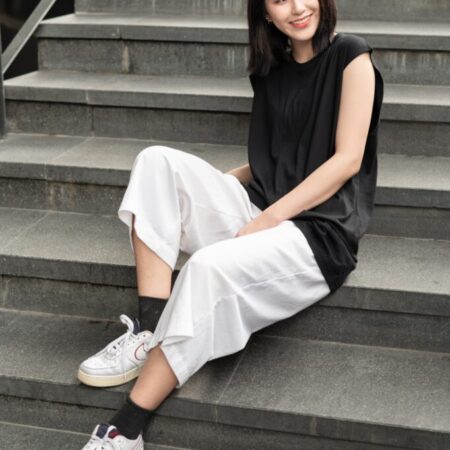 Female model with Oversized Tank Top Black T-shirt.