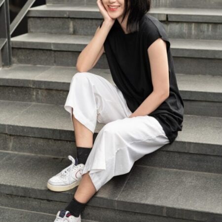Female model with Oversized Tank Top Black T-shirt.